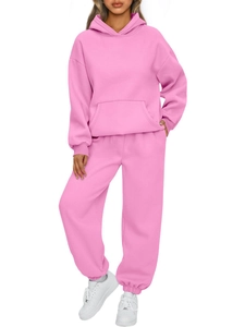 Pink women's tracksuit set with cozy drawstring hoodie and matching elastic jogger pants