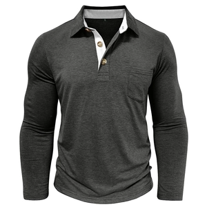 Detail of dark grey polo shirt showing wood-style buttons and contrast lining on the collar