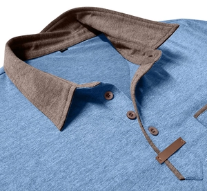 Detail of blue heather polo shirt collar with contrasting brown trim and button placket