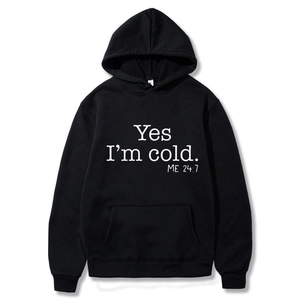 Classic black hoodie with white Yes I'm cold. ME 24:7 graphic print and kangaroo pocket