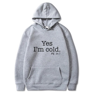 Gray hoodie featuring Yes I'm Cold ME 24:7 text with front kangaroo pocket