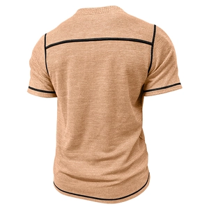 Rear view detail of apricot waffle knit Henley shirt with black piping and retro texture