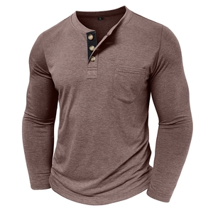Detail of men's brown long sleeve Henley shirt featuring three wood buttons and chest pocket
