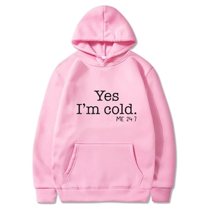 Detailed close-up of pink hoodie with Yes I'm cold text and kangaroo pocket