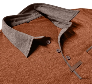 Close-up of rust-red polo shirt showing breathable knit texture and grey collar detail