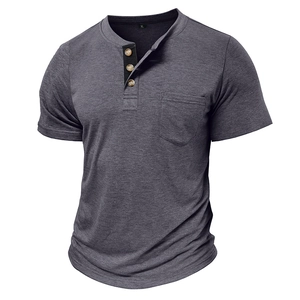 Detailed view of grey short sleeve Henley shirt with chest pocket and three-button placket