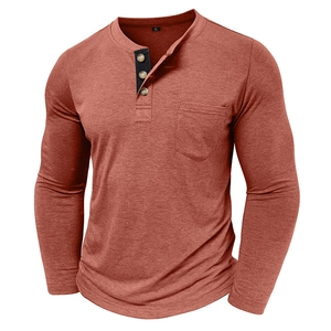 Detail of rust red Henley shirt featuring a contrast three-button placket and chest pocket