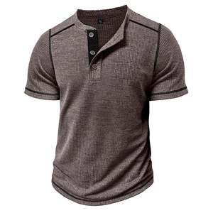Detail of waffle knit fabric and contrast black stitching on men's Henley shirt
