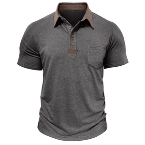 Detail view of grey short-sleeved polo shirt with brown contrast collar and chest pocket