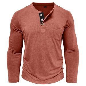 Close-up of brick red Henley shirt featuring three-button placket and black contrast pocket