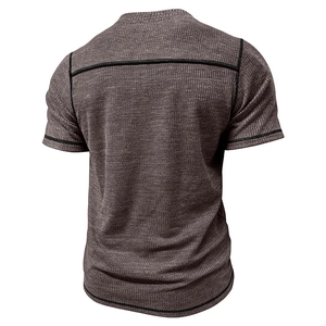 Detail view of men's brown waffle knit shirt featuring black flatlock contrast stitching