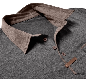 Close-up of contrast collar and three-button placket on grey cotton polo shirt
