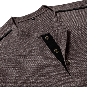Detailed macro view of Men's waffle knit Henley shirt collar with buttons and XL label