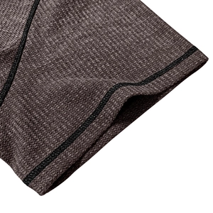 Macro shot of charcoal waffle knit fabric showing detail of durable flatlock stitching