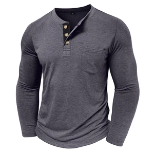 Detail of grey heather long sleeve Henley shirt featuring wood-style buttons and chest pocket