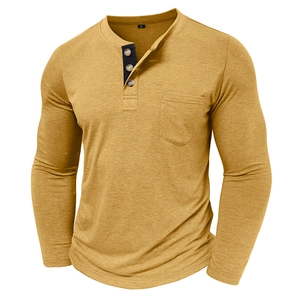 Close-up of mustard yellow long sleeve Henley shirt with three buttons and chest pocket