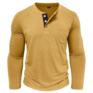 Detail of mustard yellow Henley shirt neckline with contrast placket and chest pocket