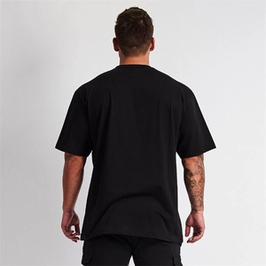 Rear view of black oversized drop shoulder t-shirt for men made of thick cotton fabric