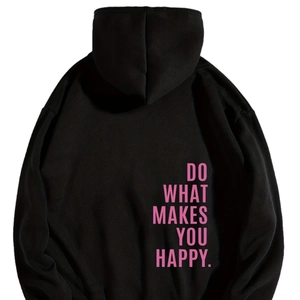 Detail view of pink slogan print on back of heavy oversized black pullover hoodie