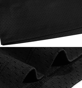 Close-up of black breathable honeycomb mesh fabric with durable double-needle stitching