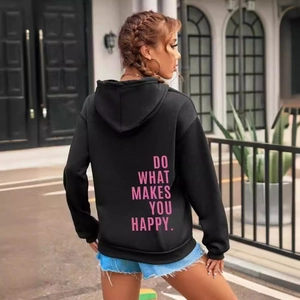 Black hoodie with pink text Do What Makes You Happy on back in street style view