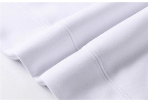 Détail de molleton de coton blanc haut de gamme avec tricot côtelé et coutures précises
