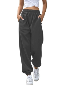 Detail view of dark grey high-waisted joggers with drawstring waist and elastic cuffs