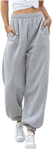Detail of light grey high-waisted joggers featuring elastic waistband and large side pockets