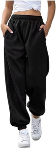 Detail of high waisted black sweatpants showing elastic waistband and side pocket detail