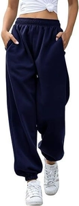 Detail view of high-waisted navy blue sweatpants with elastic waistband and side pockets