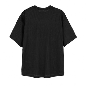 Detail shot of breathable black mesh fabric on a loose fitness t-shirt with round neck
