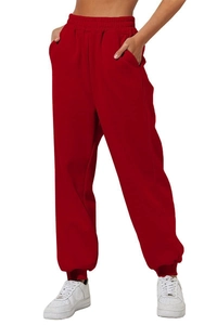 Detailed view of women's red high waist joggers with elastic waistband and side pockets