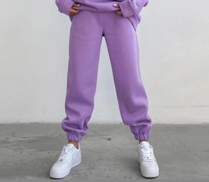 Detail view of high-waisted lavender joggers in soft cotton fleece for a cozy sport look