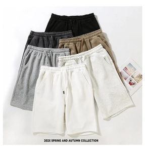 Detail view of cotton wide-leg sweatshorts in various solid colors with drawstring