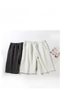 Close-up of drawstring elastic waistband on knit cotton wide-leg casual shorts