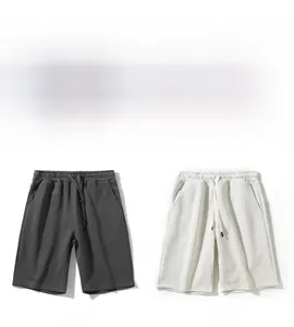 Detail view of cotton drawstring athletic shorts in charcoal and light heather grey finishes