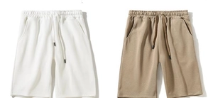 Detailed close-up of breathable cotton shorts with elastic waistband and drawstring