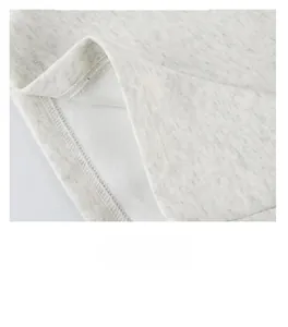 Detailed close-up showing double-needle stitching and grey cotton fabric texture