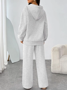 Back view of light grey women's oversized hoodie and wide-leg trousers lounge set