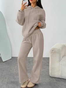 Detail of taupe oversized hoodie and wide-leg jogger pants in premium thick cotton fabric