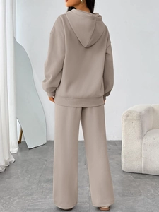 Back view of a premium cream oversized hoodie and matching wide-leg trousers lounge set