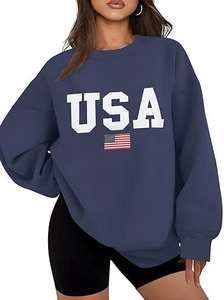 Macro detail of the oversized dark blue sweatshirt featuring a bold USA flag print design