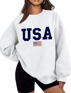 Close-up of USA letter print and flag detail on oversized white cotton sweatshirt
