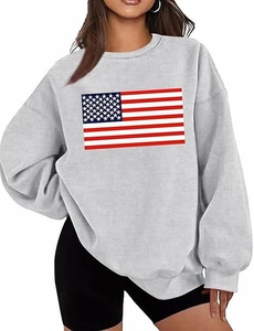Detailed view of the American flag print on a grey oversized crewneck sweatshirt