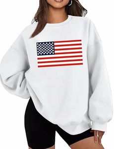 Detail of white oversized sweatshirt featuring a vibrant American flag graphic print