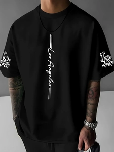 Close-up of Los Angeles white lettering and LA logo on black cotton street T-shirt