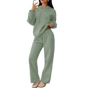 Women's sage green casual tracksuit set featuring a hooded sweatshirt and wide-leg pants