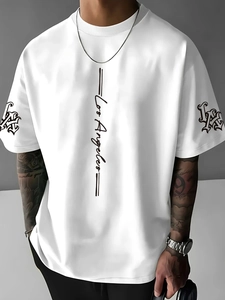 Detail of Los Angeles script print and Gothic LA logo on white short sleeve T-shirt