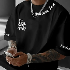 Detailed view of Gothic LA lettering and American Tour print on black cotton t-shirt