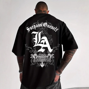 Men's oversized black t-shirt featuring white gothic lettering print on the back